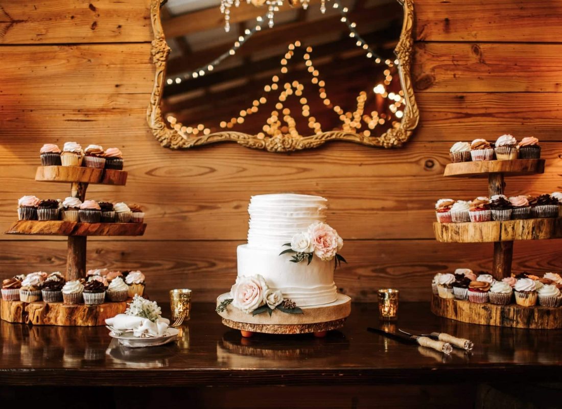 Master baker handcrafting an intricate, multi-tier wedding cake using premium ingredients in a professional kitchen